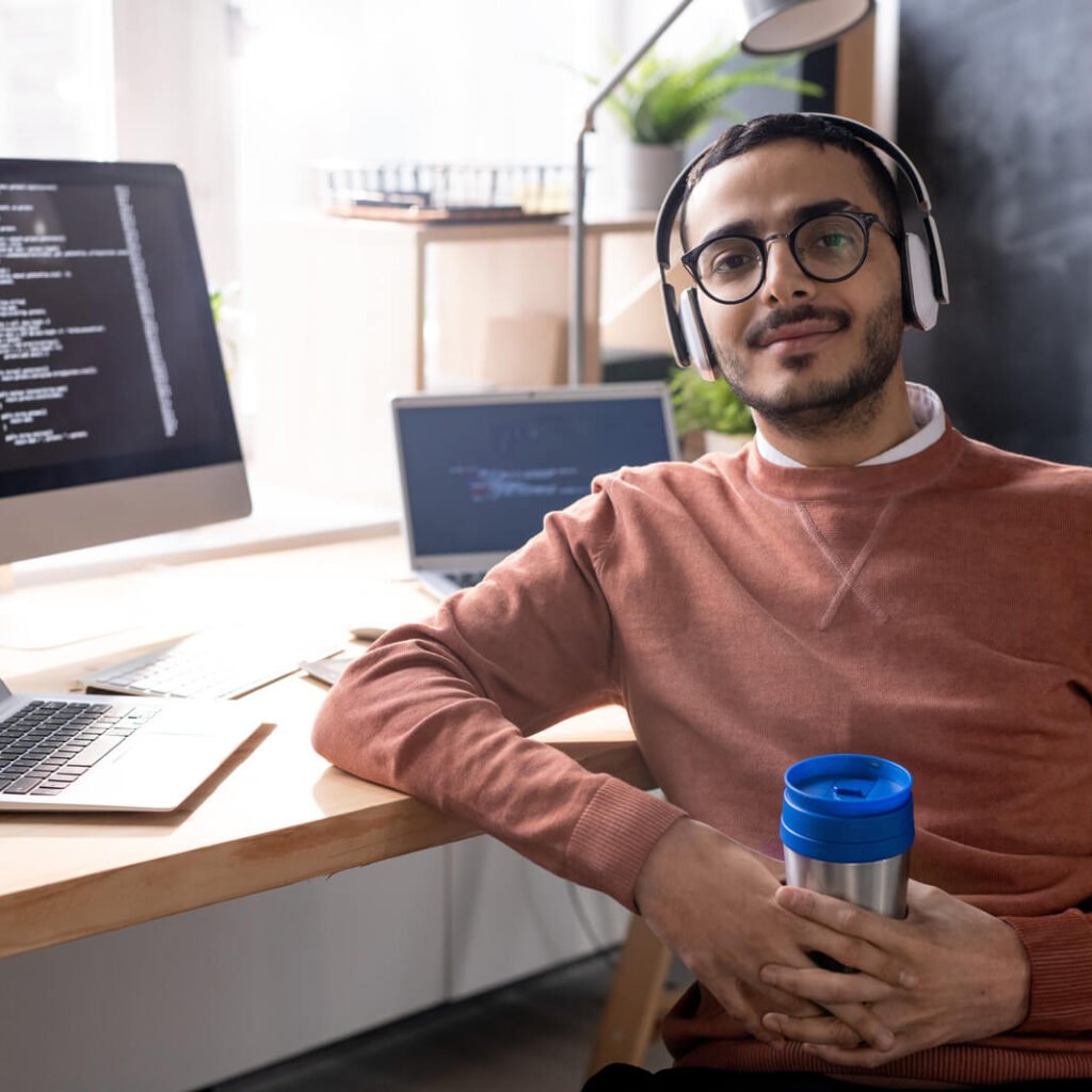 handsome programmer in headphones listening to mus 2023 11 27 04 56 48 utc